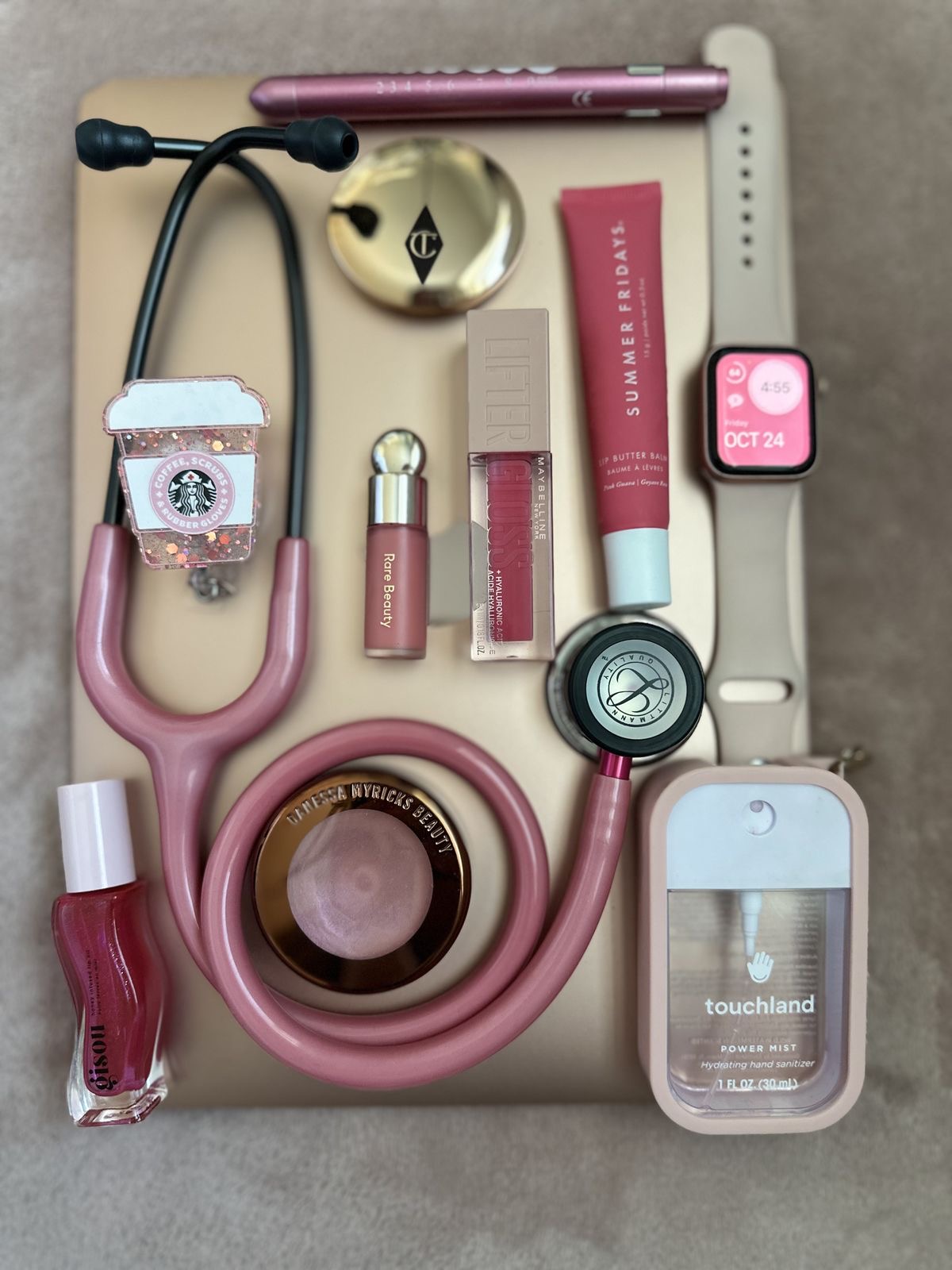 Pink wellness flatlay with lipstick, watch, sanitizer — Digital Wellness Products collection